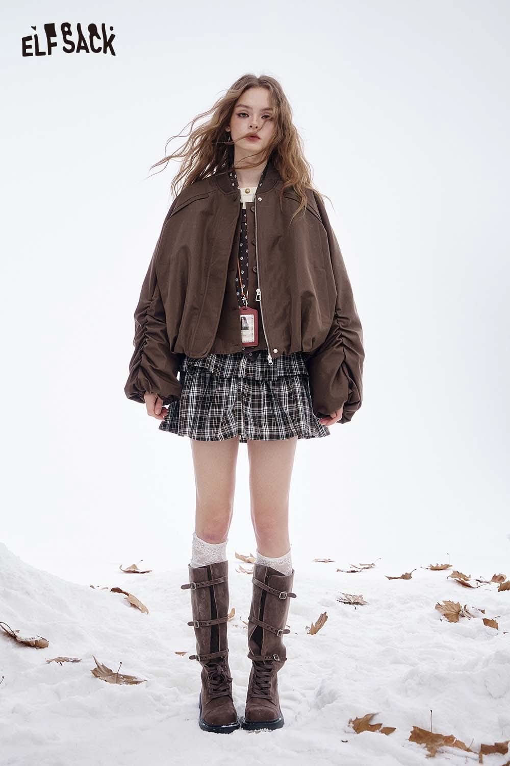 ELFSACK women's puff sleeve down jacket in brown, styled with a plaid skirt and knee-high boots