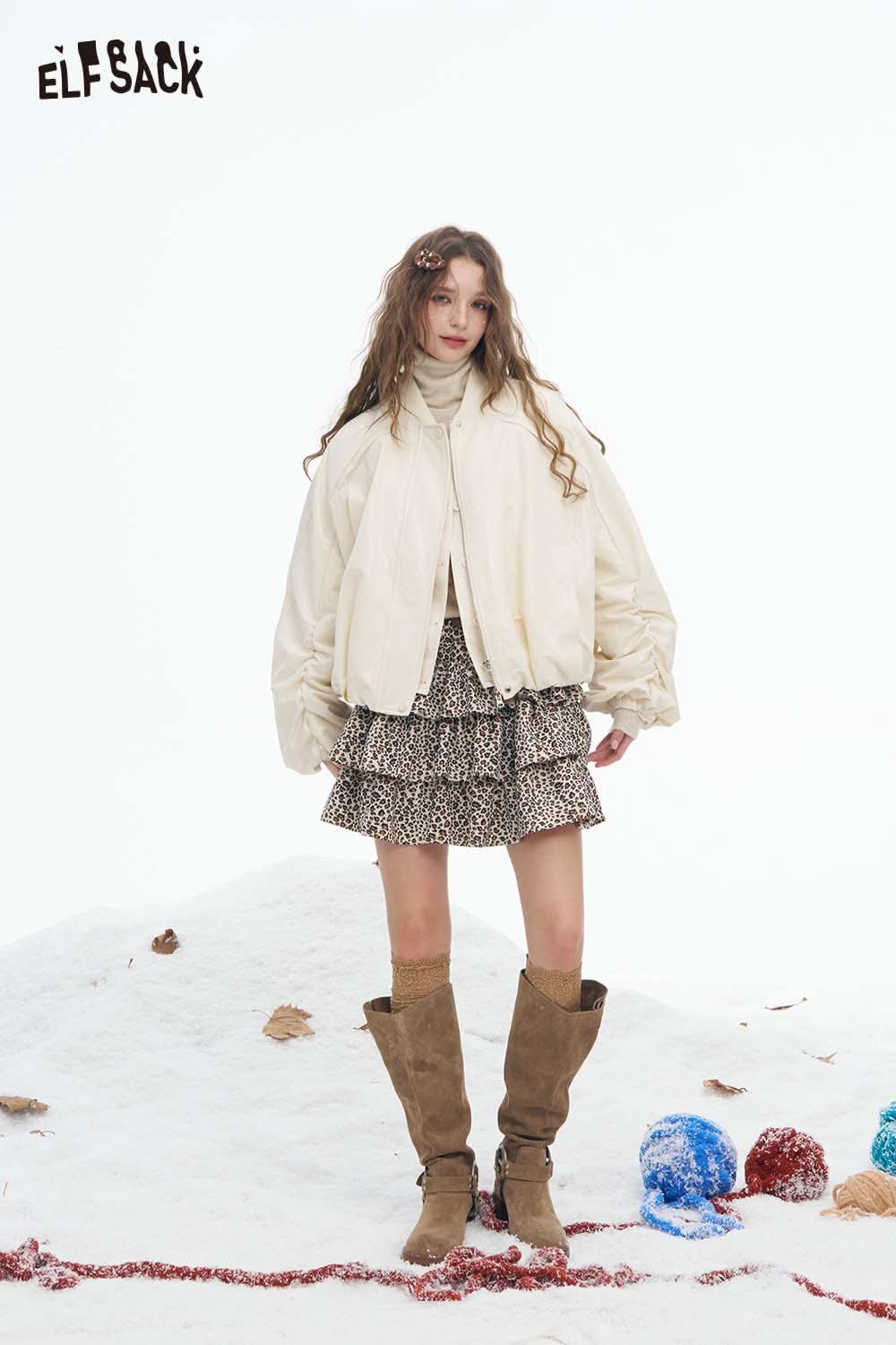 ELFSACK women's puff sleeve down jacket styled with a trendy skirt and knee-high boots