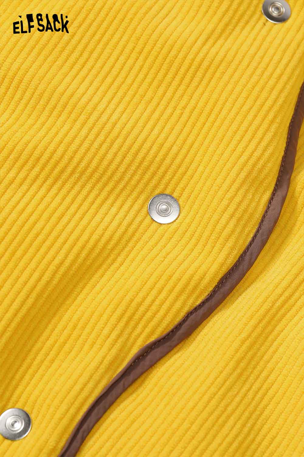 Close-up of ELFSACK women's reversible down jacket with textured yellow fabric and snap buttons