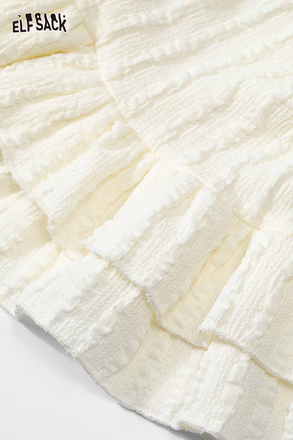 ELFSACK women's ruffle high neck t-shirt in soft cream fabric with textured detailing