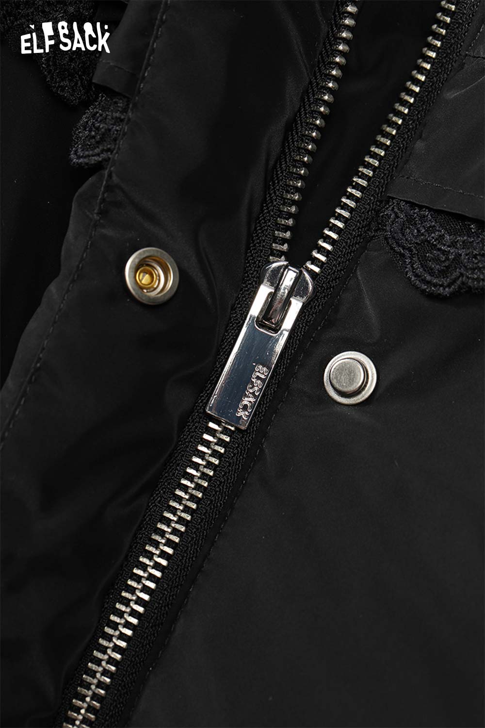 Close-up of ELFSACK women's ruffle puffer down jacket zipper and buttons for stylish warmth