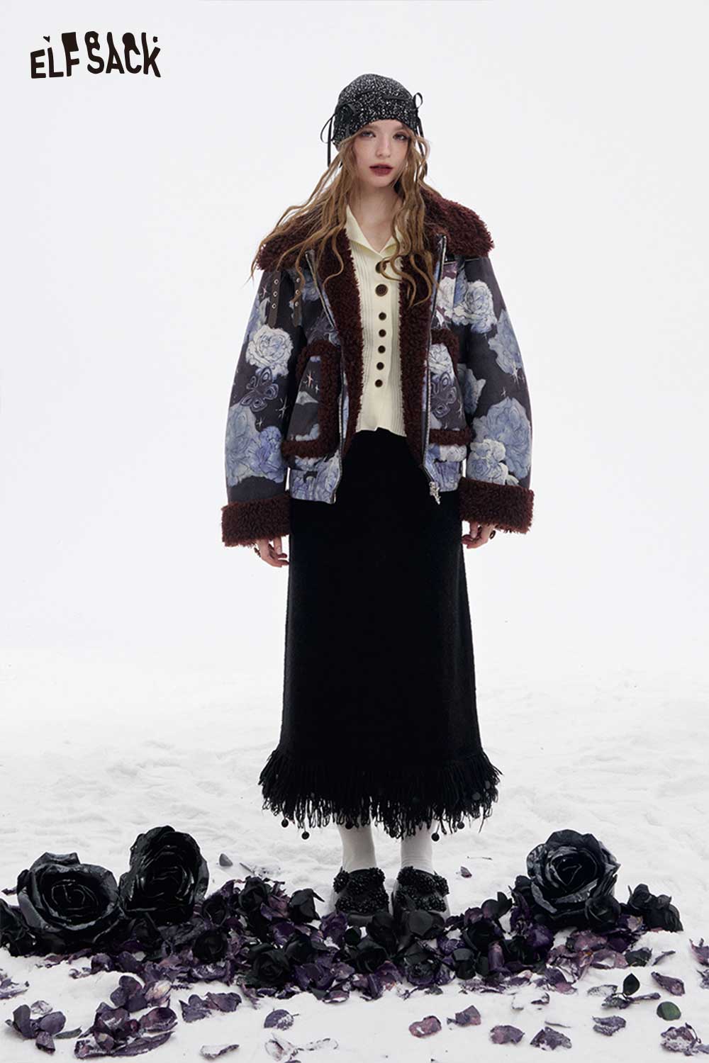 ELFSACK women's slim fit v neck knitwear paired with a floral jacket and fringed skirt for a stylish look