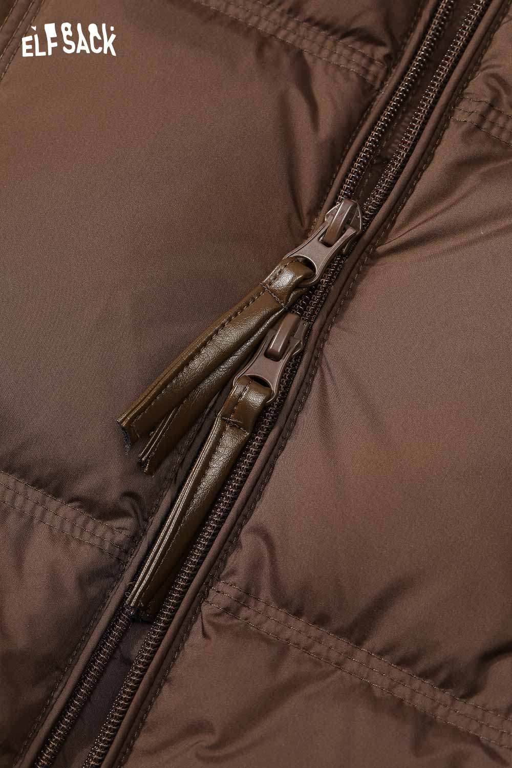 Close-up of ELFSACK women's soft down jacket zipper detailing in brown fabric