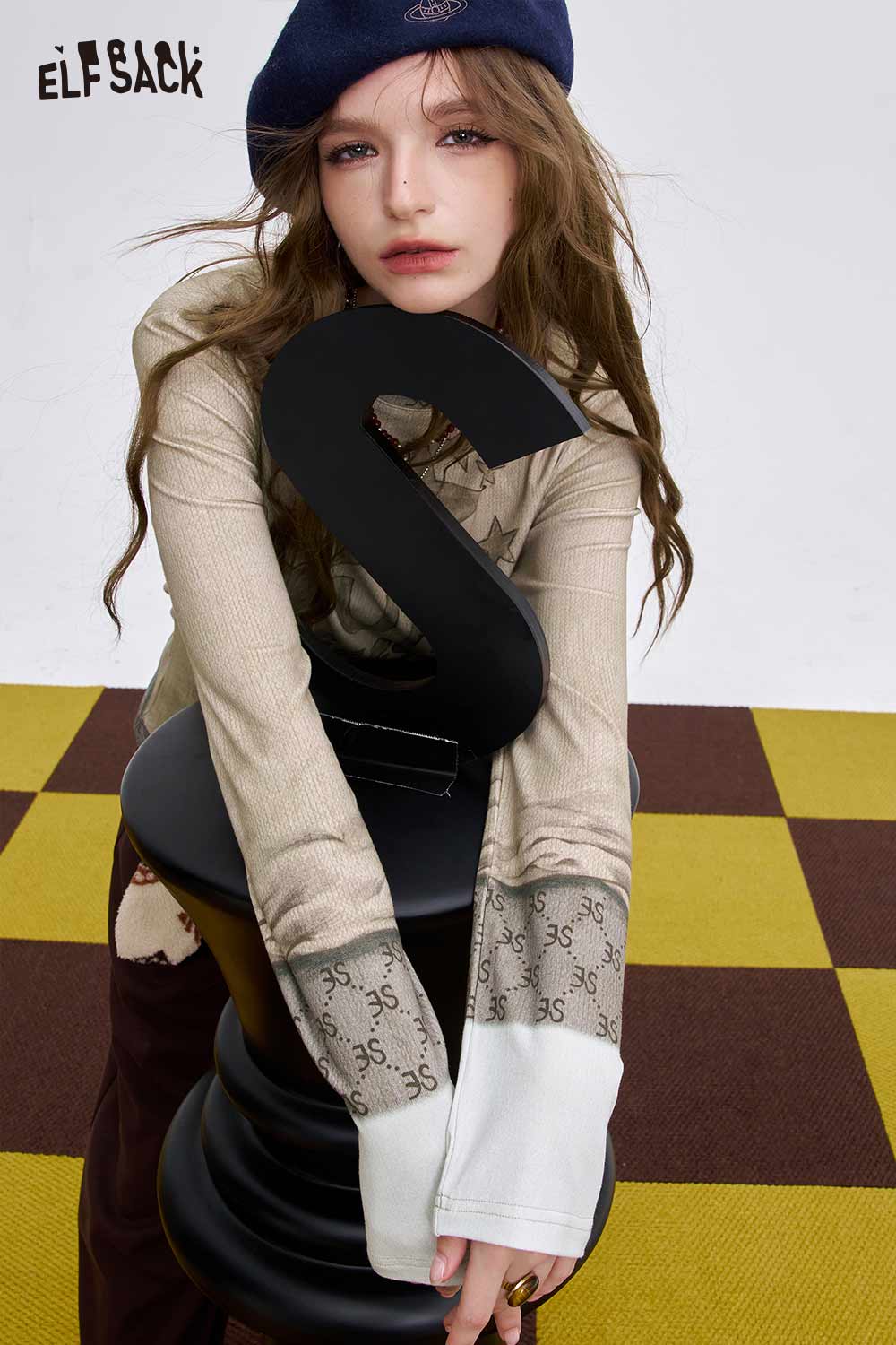 ELFSACK women's soft graphic long sleeve t-shirt featuring stylish sleeves and a trendy design