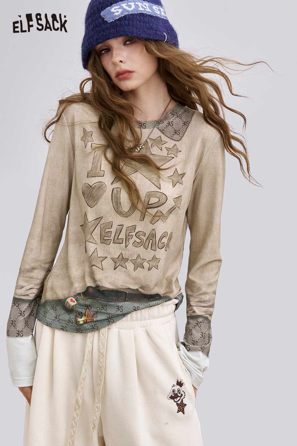 ELFSACK women's soft graphic long sleeve t-shirt featuring playful star and heart design