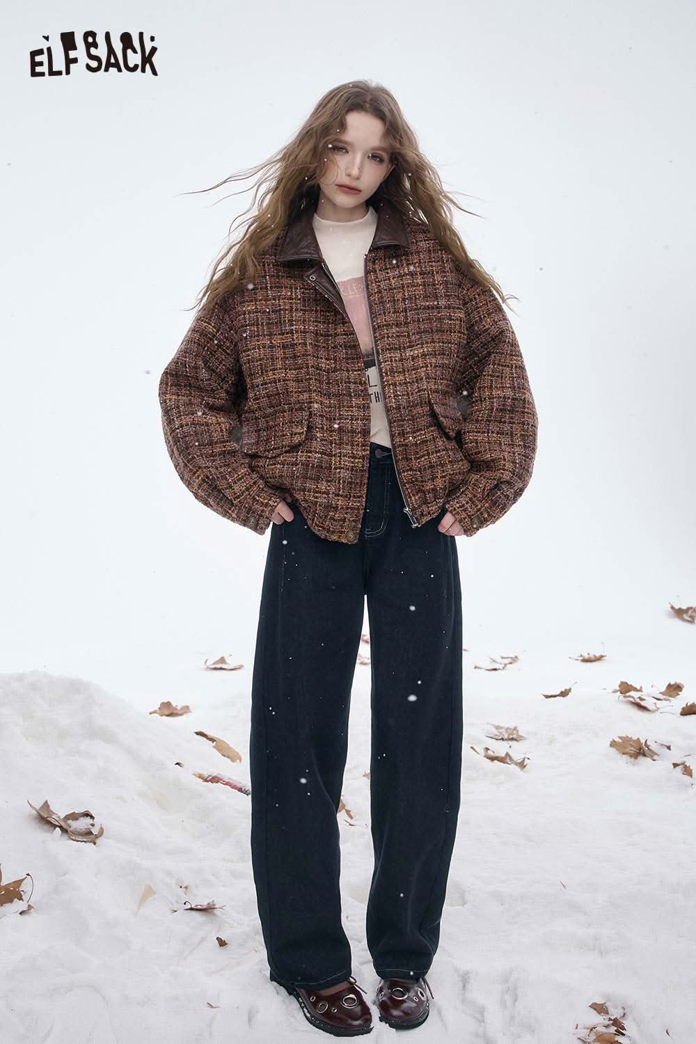 ELFSACK women's straight leg jeans in dark wash paired with a cozy brown jacket in snowy setting.