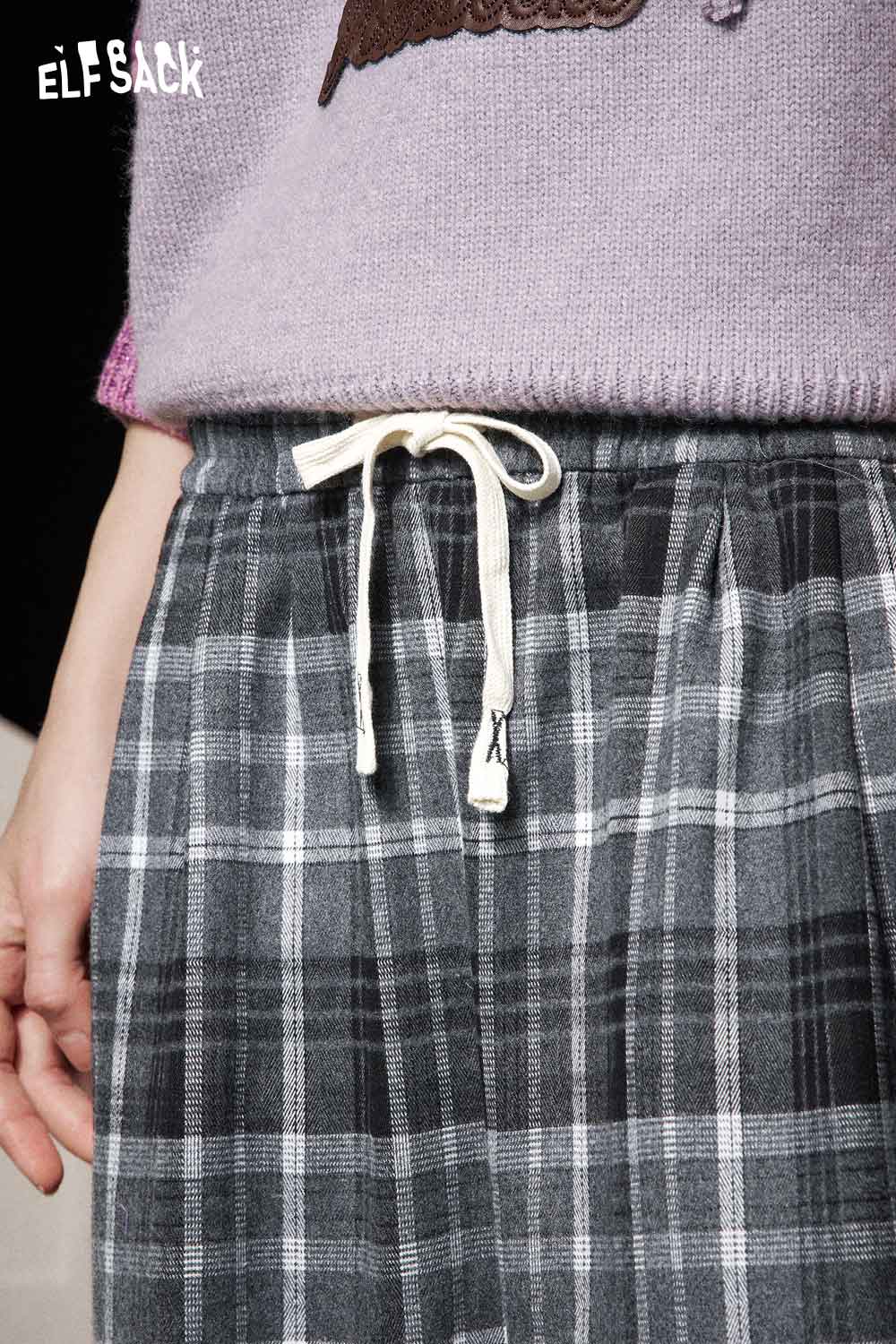 Close-up of ELFSACK women's striped drawstring pants with a soft elastic waistband and plaid pattern