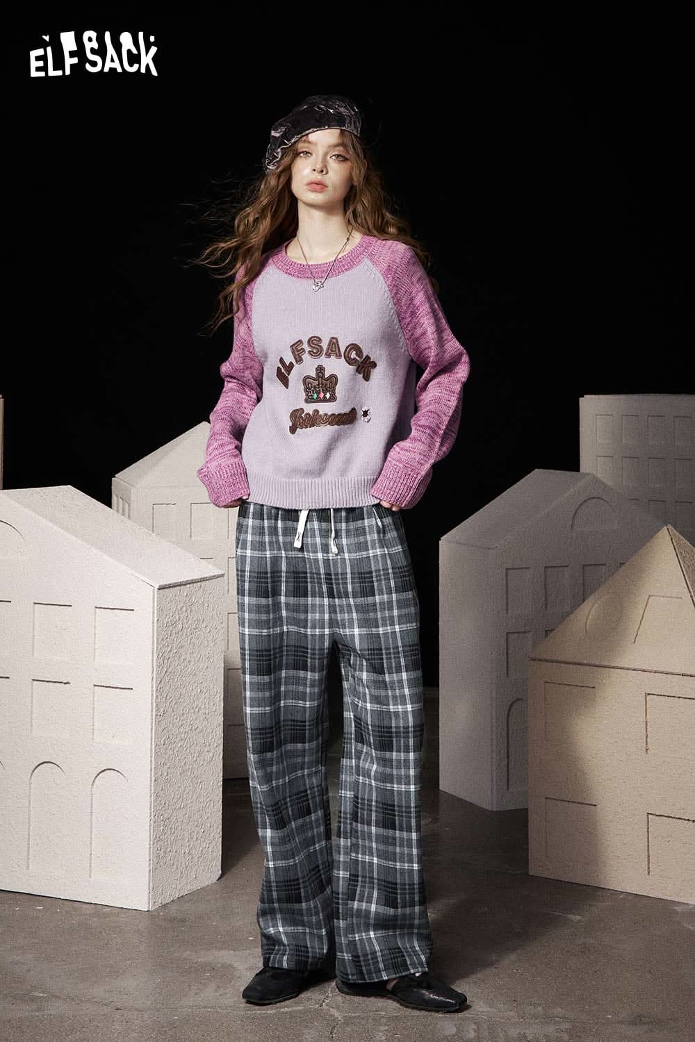 Stylish ELFSACK women's striped drawstring pants paired with a cozy sweater for a fashionable look