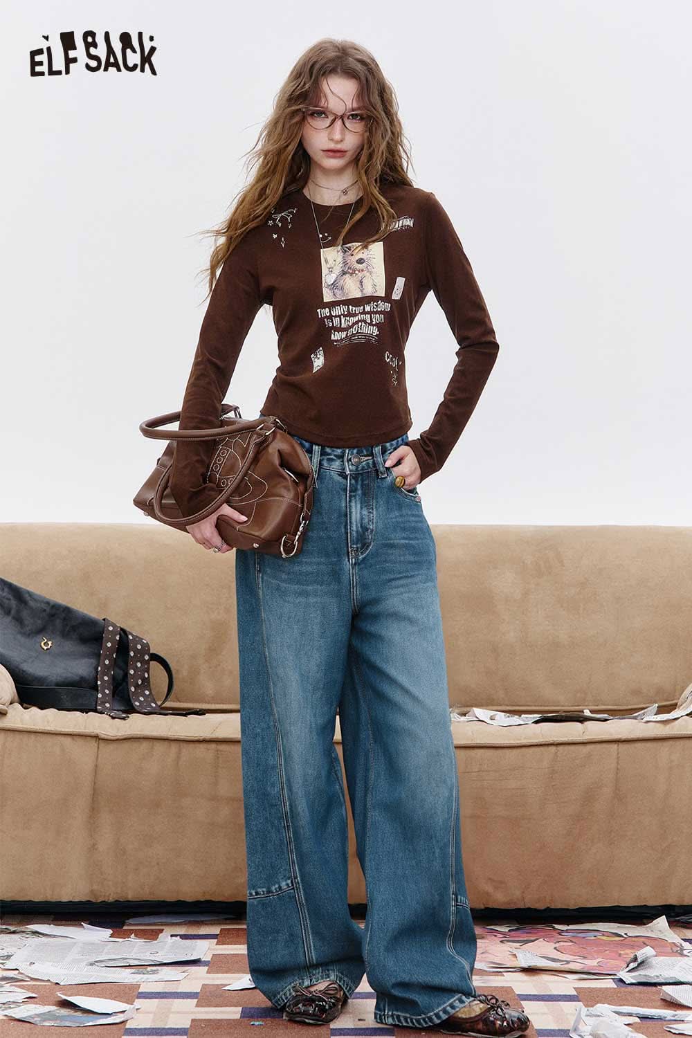 ELFSACK women's vintage washed jeans styled with a brown shirt and oversized bag for a trendy look
