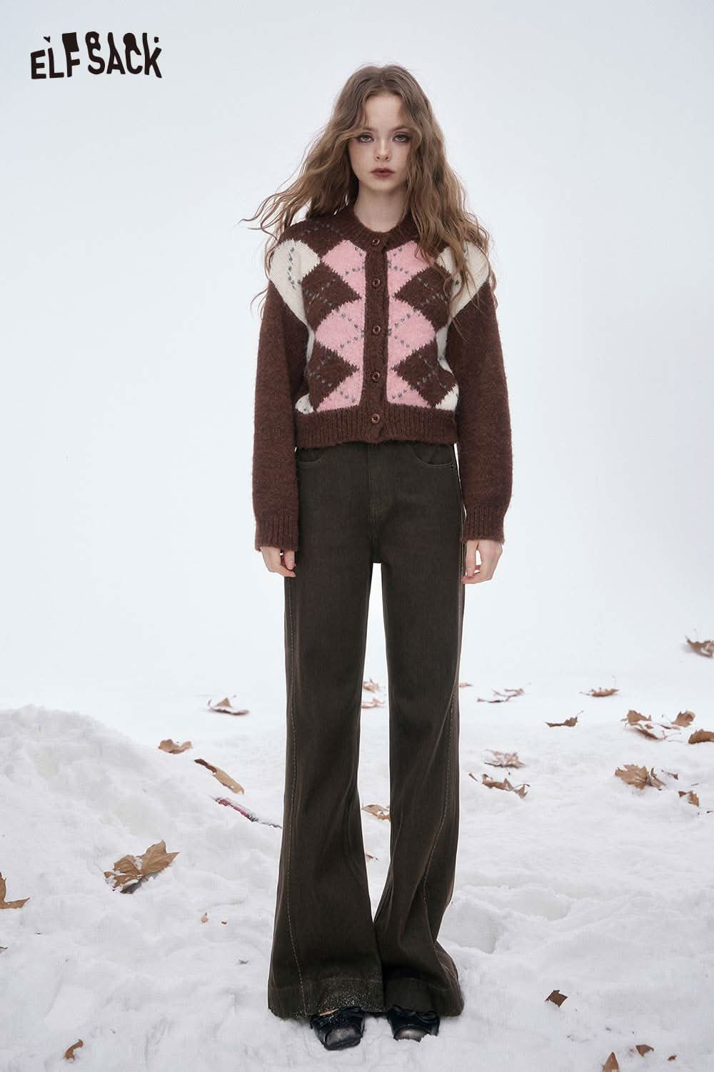ELFSACK women's wide leg floor length jeans paired with a stylish argyle cardigan in snowy setting