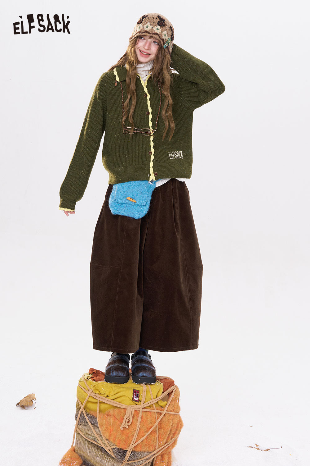ELFSACK women's wide leg pants in brown paired with a cozy green sweater and stylish accessories
