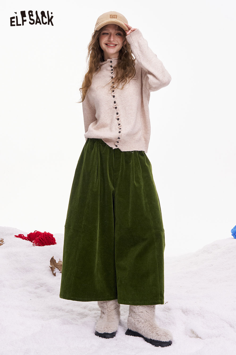 ELFSACK women's wide leg pants in green corduroy paired with a cozy sweater and winter boots