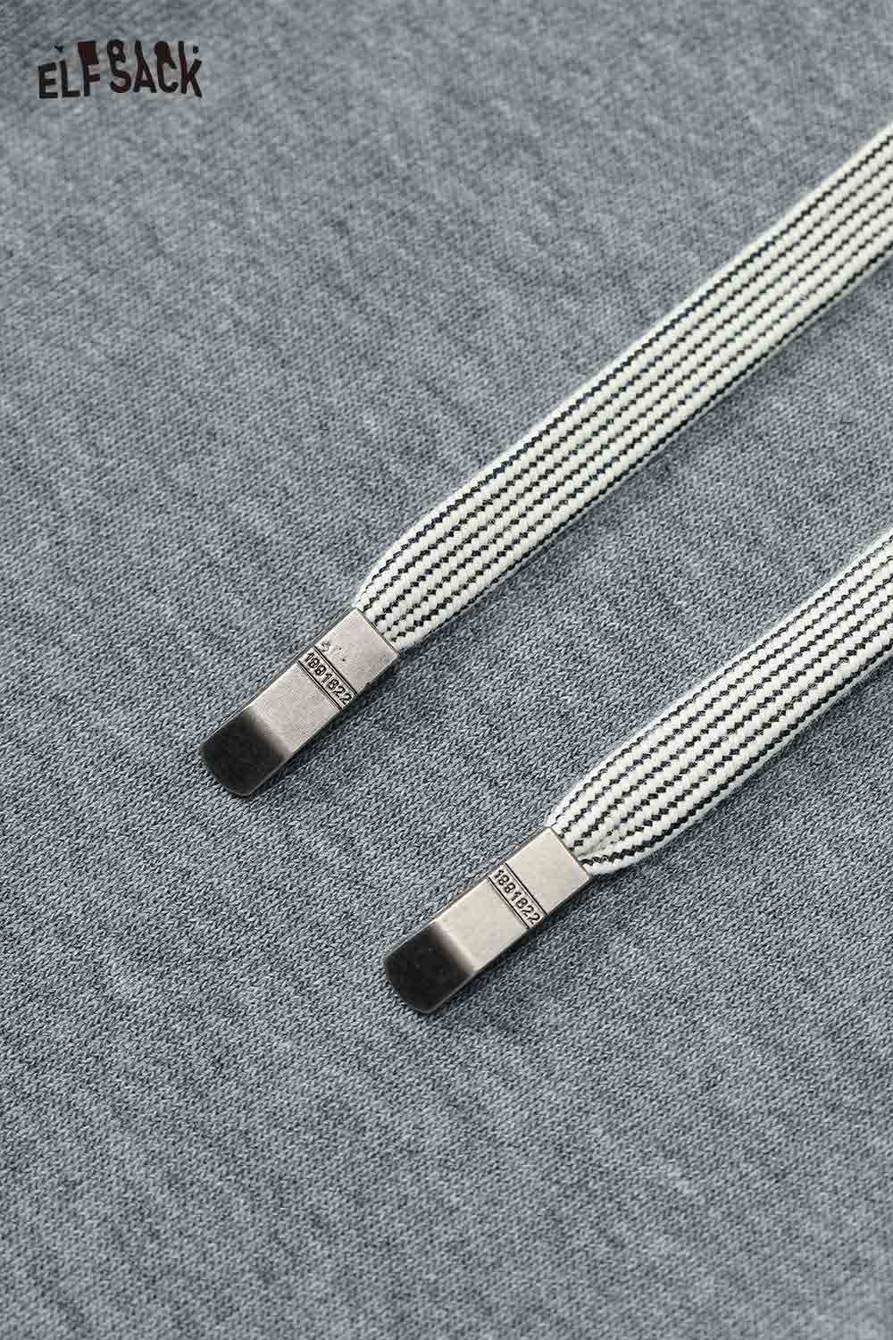 Close-up of ELFSACK women's wide leg sweatpants with stylish drawstring details