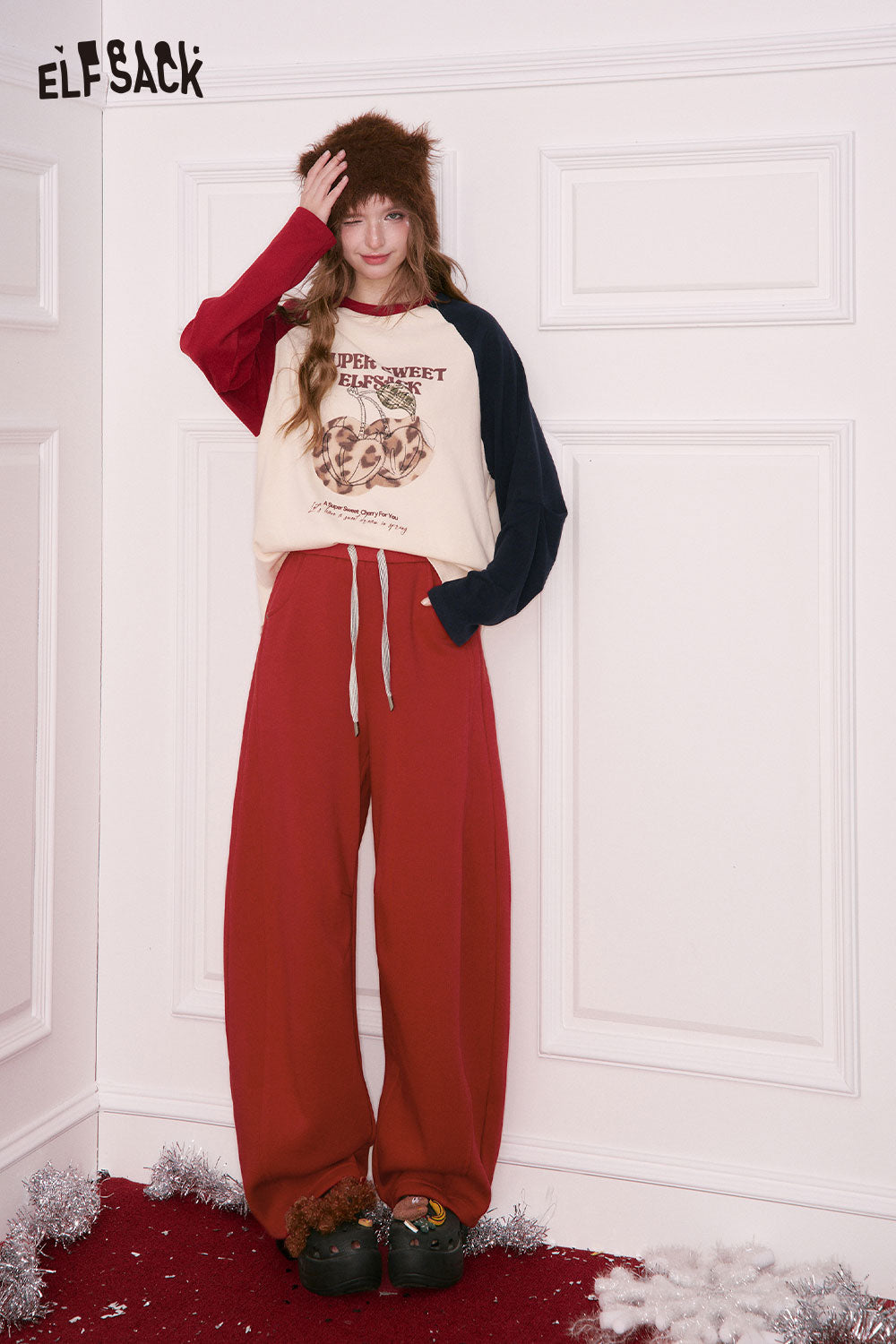 ELFSACK women's wide leg sweatpants in red, styled with a graphic sweatshirt for a casual look