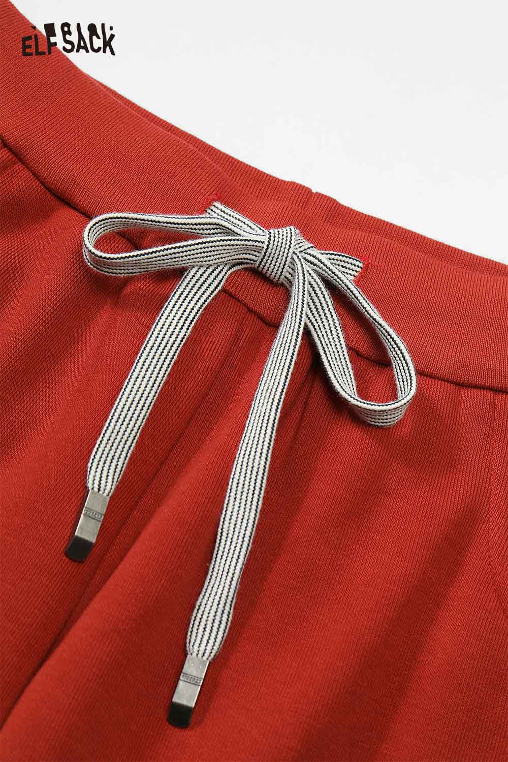 Close-up of ELFSACK women's wide leg sweatpants featuring a stylish drawstring detail