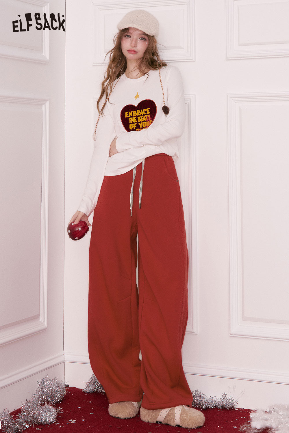 ELFSACK women's wide leg sweatpants in red, styled with a cozy top and soft slippers