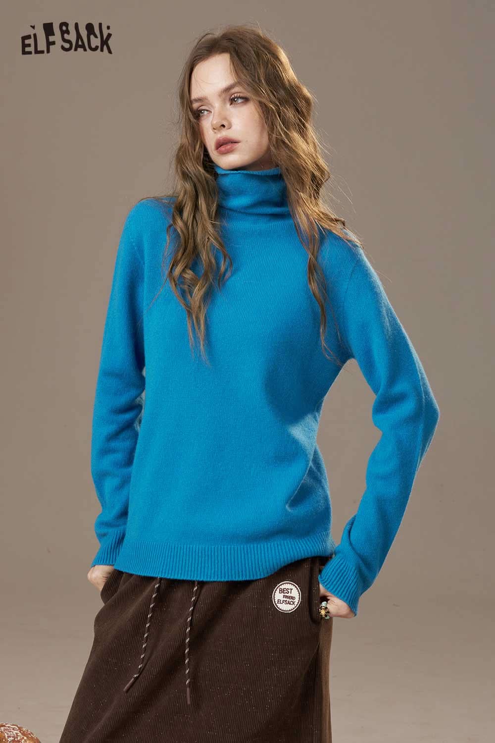 Women's wool turtleneck sweater by ELFSACK in vibrant blue, perfect for cozy winter style