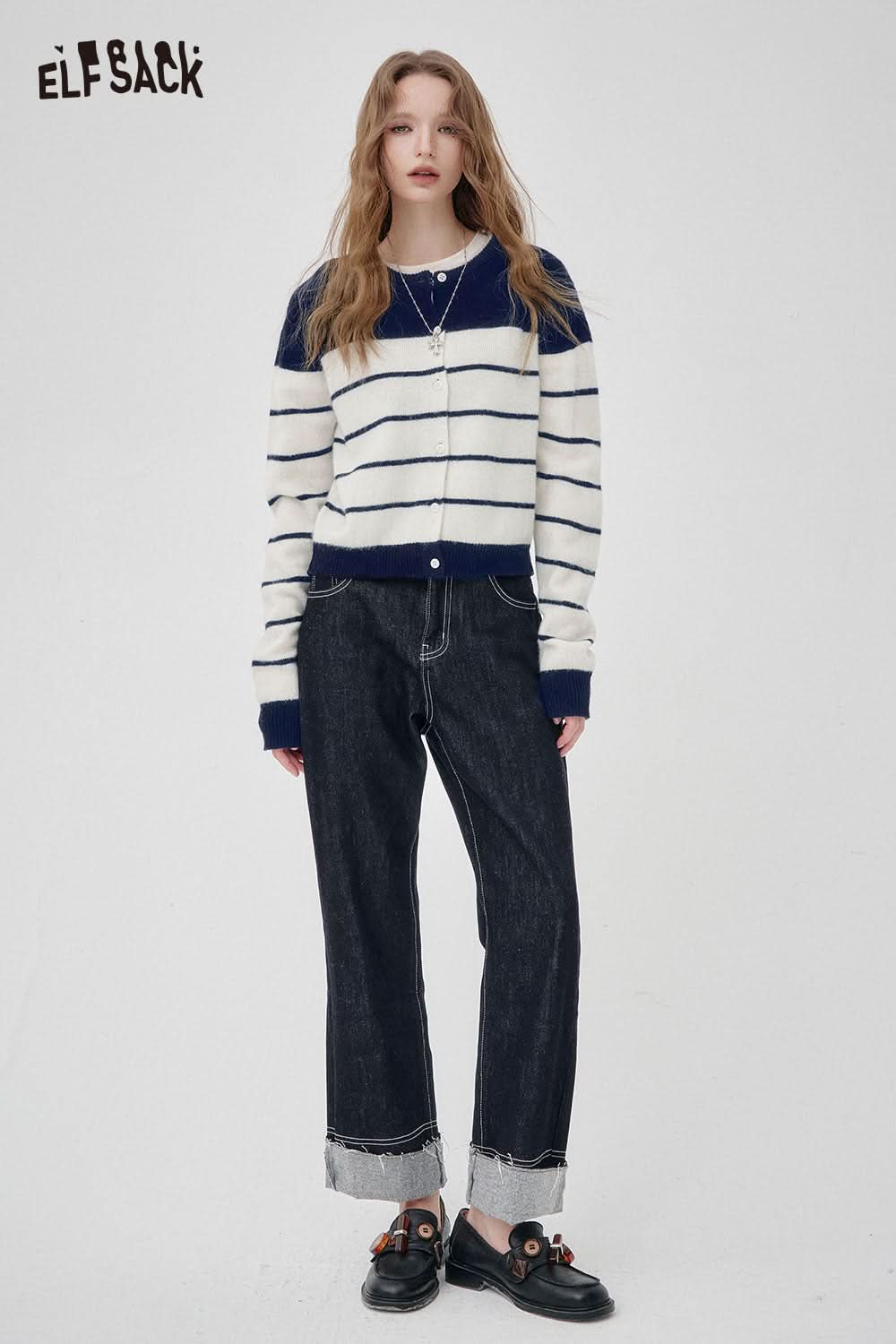 ELFSACK wool blend striped turtleneck sweater with navy and white stripes, styled with black jeans