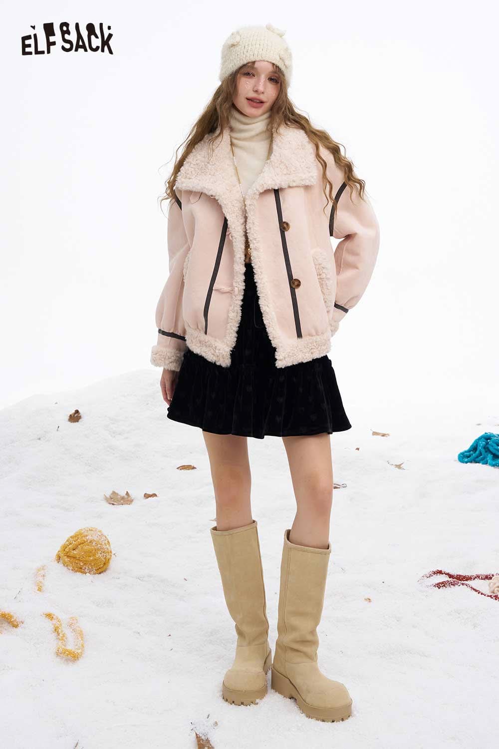 ELFSACK wool high neck sweater women styled with a pink outer jacket and skirt in a snowy setting