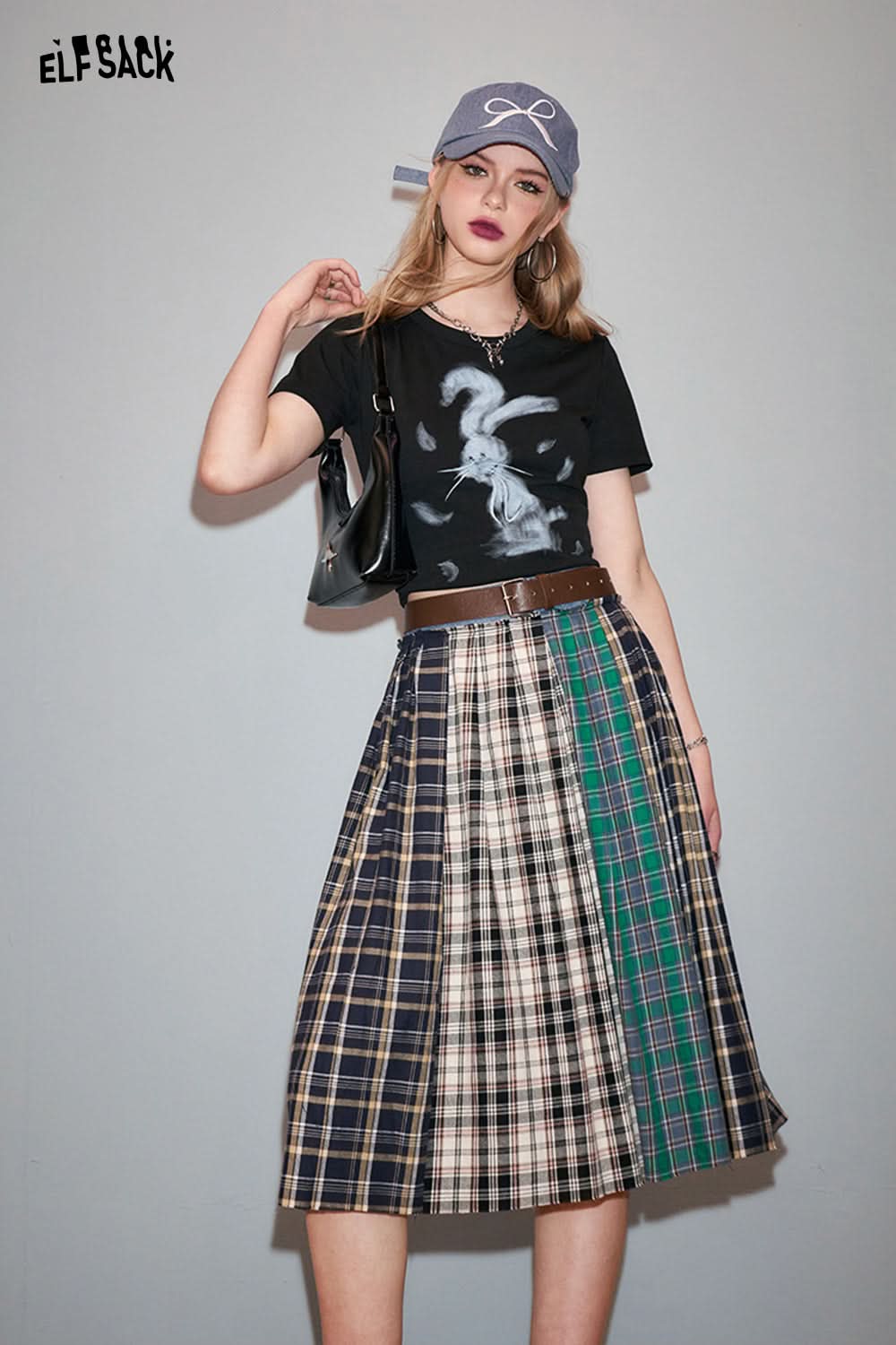 ELFSACK Y2K Rabbit Print black t-shirt styled with a plaid skirt and casual accessories
