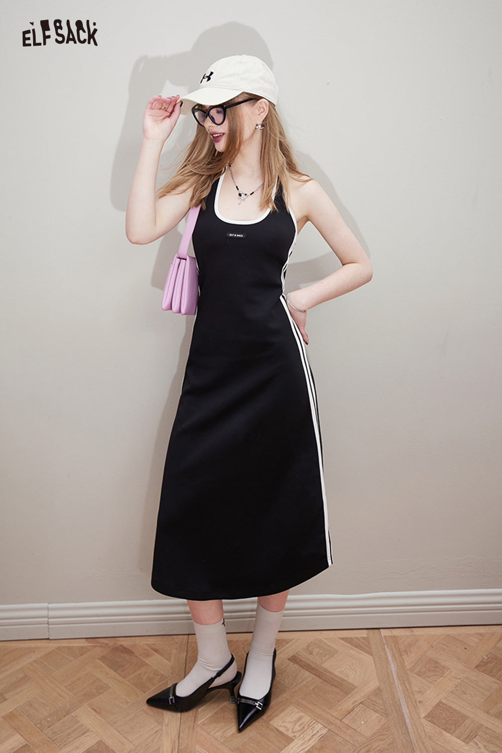
                  
                    ELFSACK Sports style black suspender dress for women's spring 2024 new slimming hanging neck long skirt
                  
                
