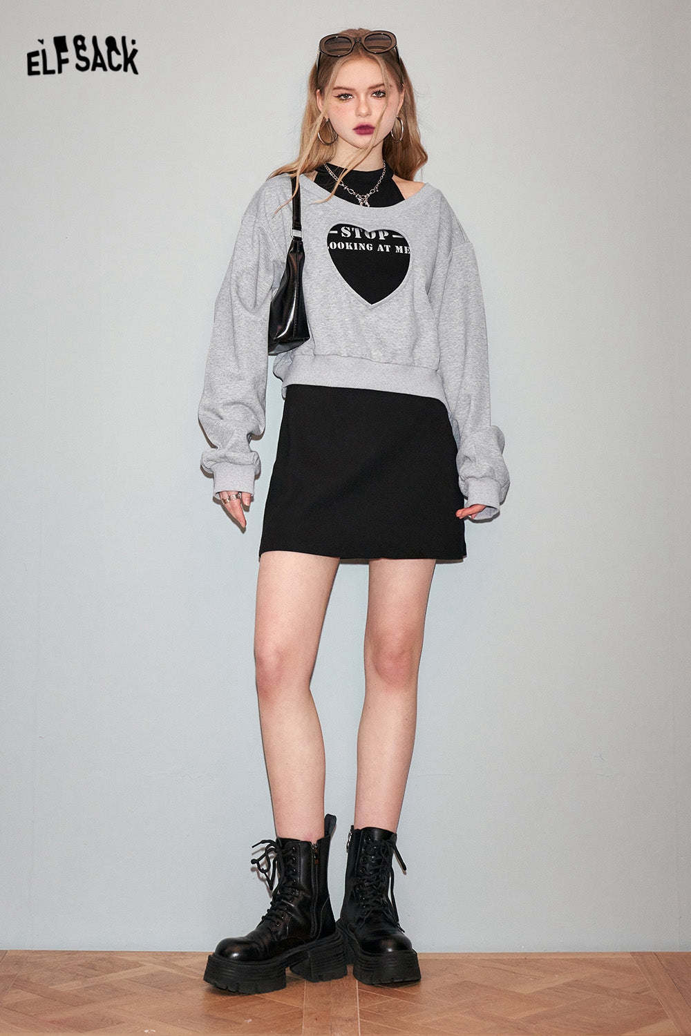 ELFSACK Two piece set of heart-shaped hollow out hoodie with suspender dress's spring design sense skirt