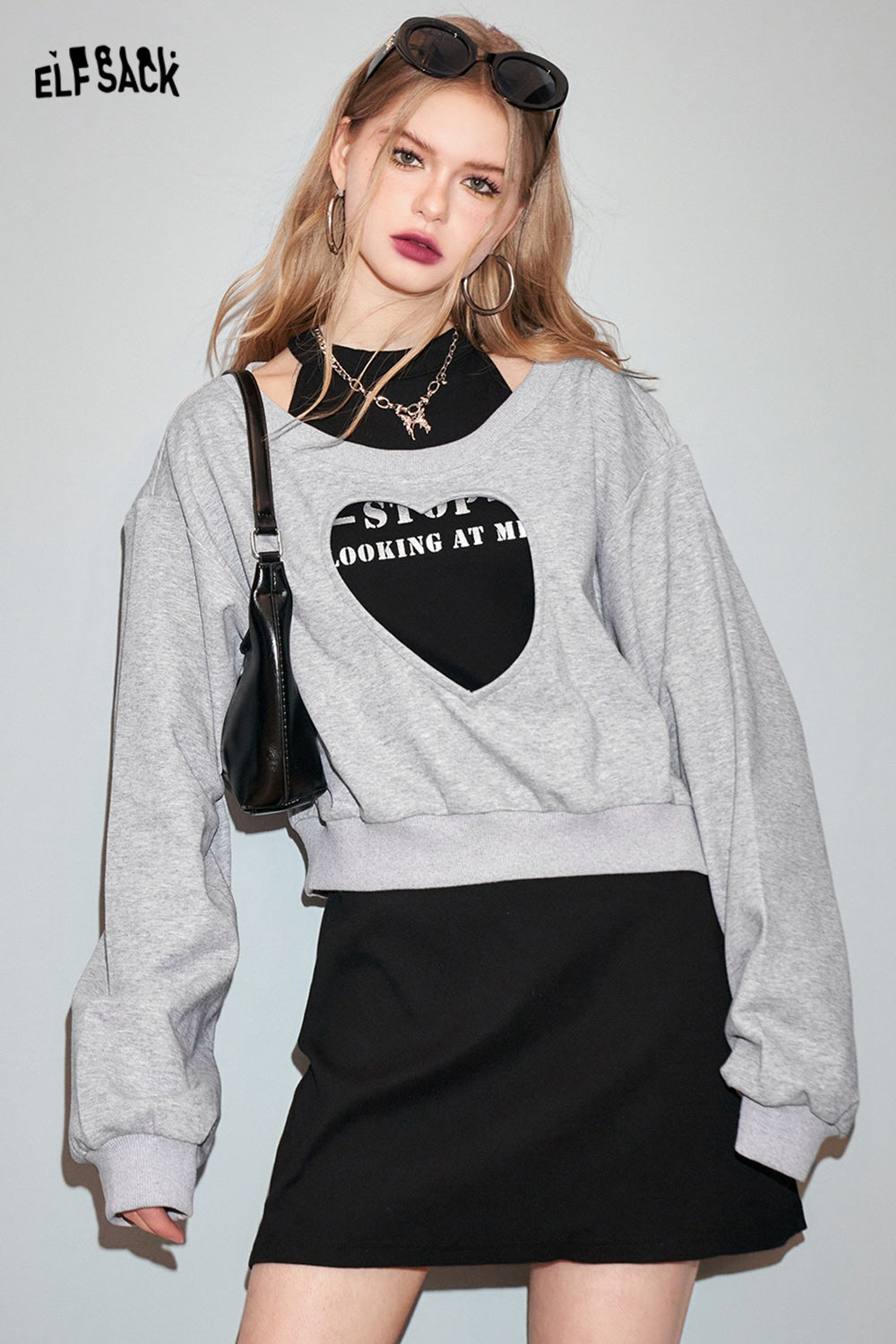 ELFSACK Two piece set of heart-shaped hollow out hoodie with suspender dress's spring design sense skirt