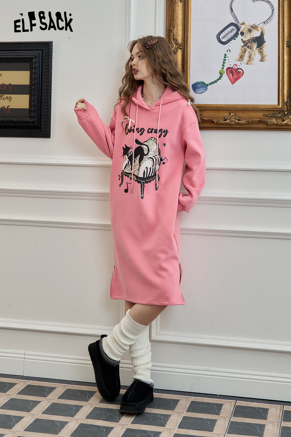 
                  
                    ELFSACK 2024 Winter New Arrivals White loose casual cartoon print sweater long dress for women
                  
                