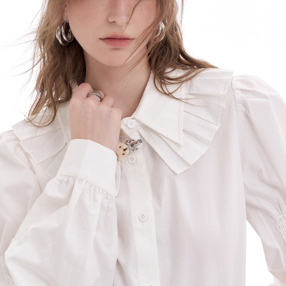 
                  
                    ELFSACK 2025 Spring New Arrivals White Ruffled Doll Collar Cotton White Shirts Long-sleeved Women European Clothes Tops
                  
                