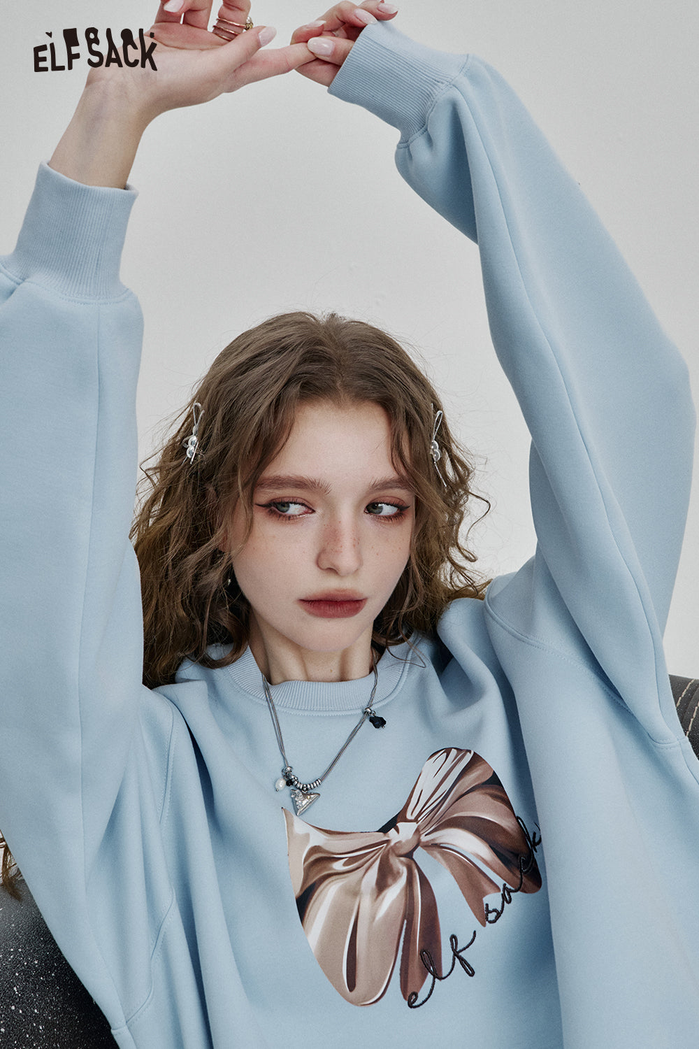 ELFSACK Y2K Dopamine Bowknot Print Loose O-neck Sweatshirt Women