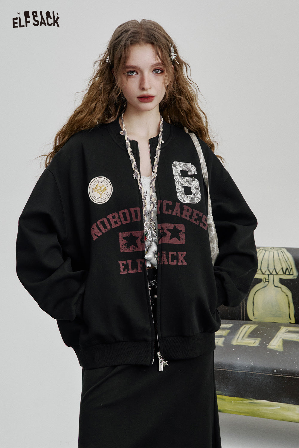 ELFSACK Sweet and cool black printed skirt baseball jacket two-piece suit female casual sports suit
