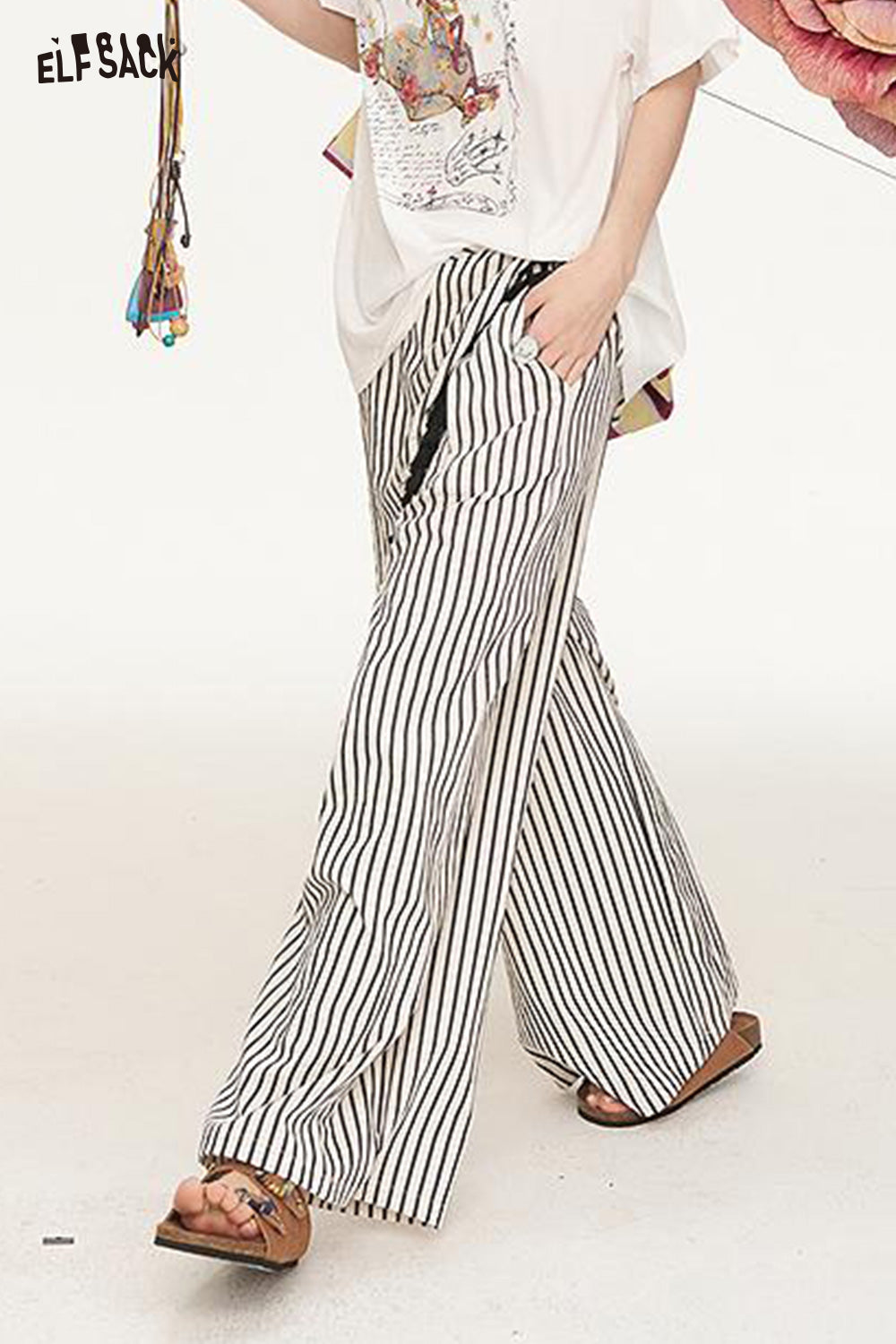 ELFSACK 2025 Summer New Arrivals Irregular Fart Curtain Fringe Stripe Straight Leg Wide Leg Casual Pants For Women