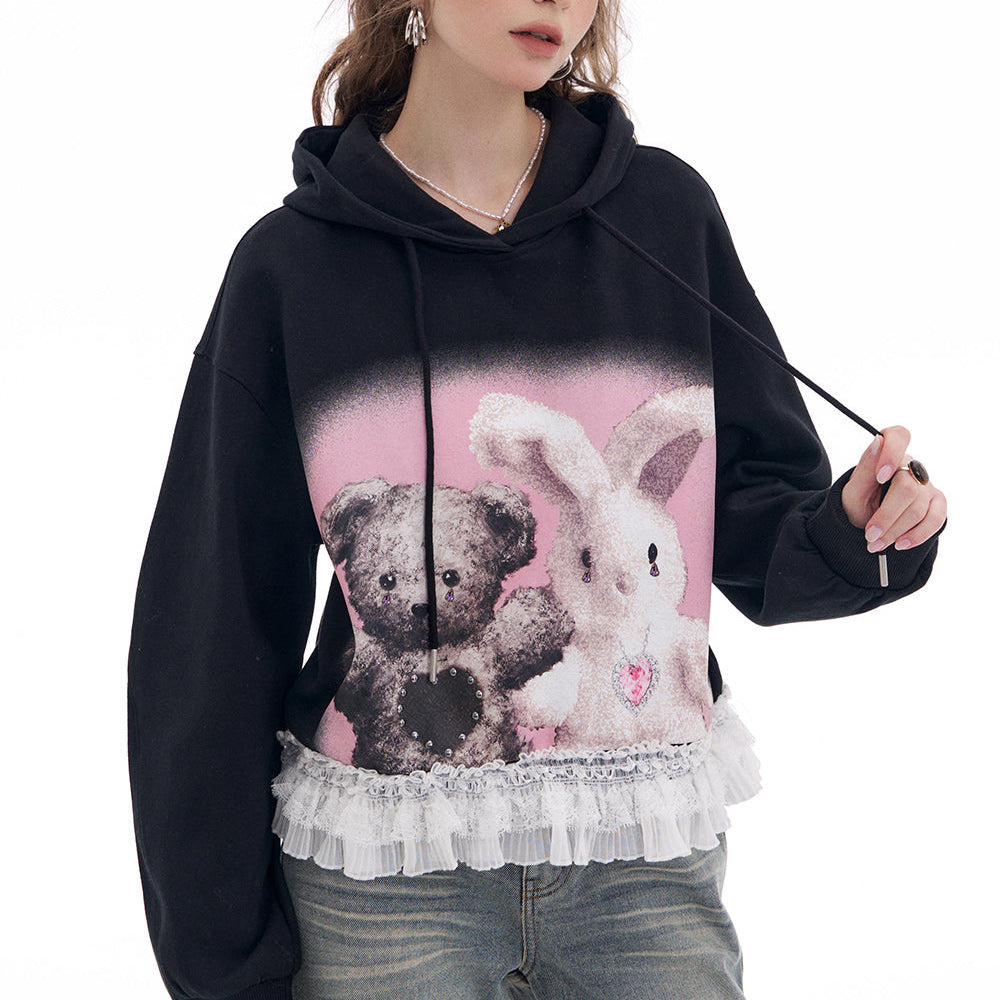 ELFSACK 2025 Spring New Arrivals Y2K Black Lace Stitching Cartoon Printed Hooded Sweatshirt Women