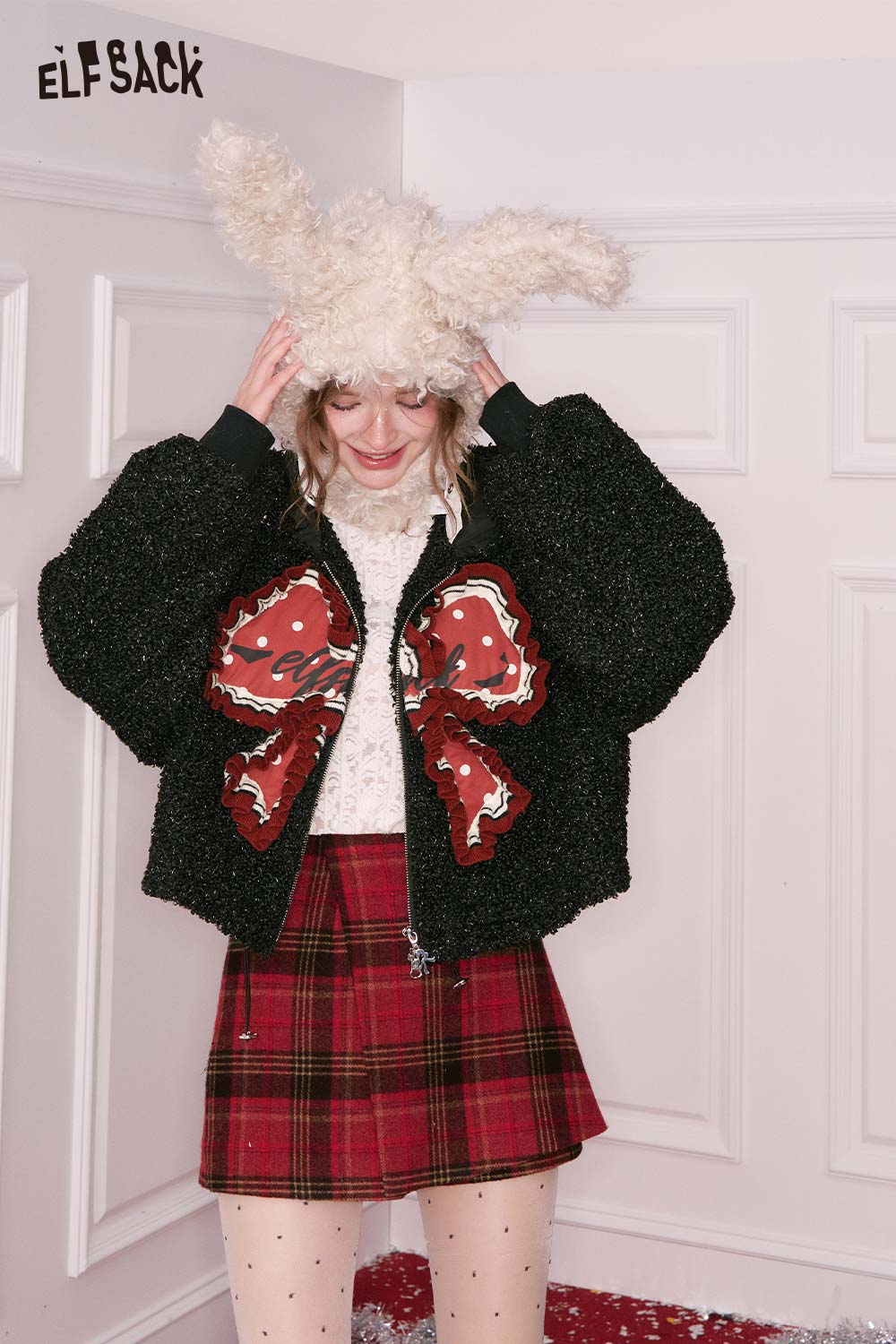 ELFSACK 3D bow glitter plush jacket in black with a playful design, perfect for winter fashion