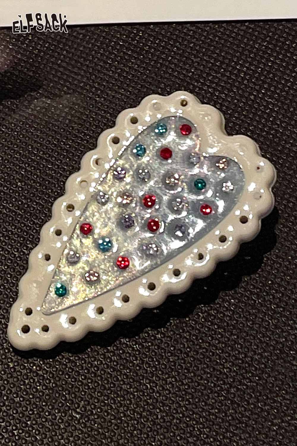 ELFSACK crystal embellished heart hairpin white scalloped frame silver glitter center with multicolor rhinestones