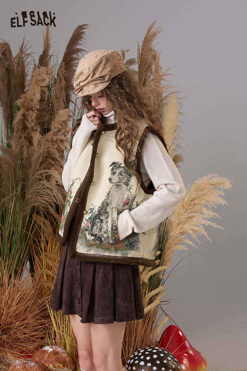ELFSACK animal embroidery knit vest featuring a detailed animal design on a cream background