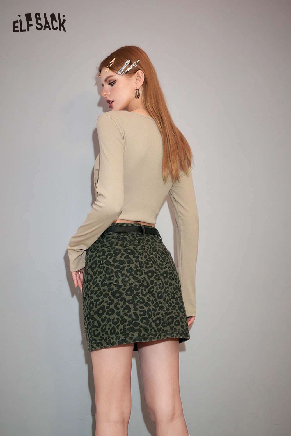 ELFSACK animal print denim mini skirt styled with a long sleeve top for a trendy look