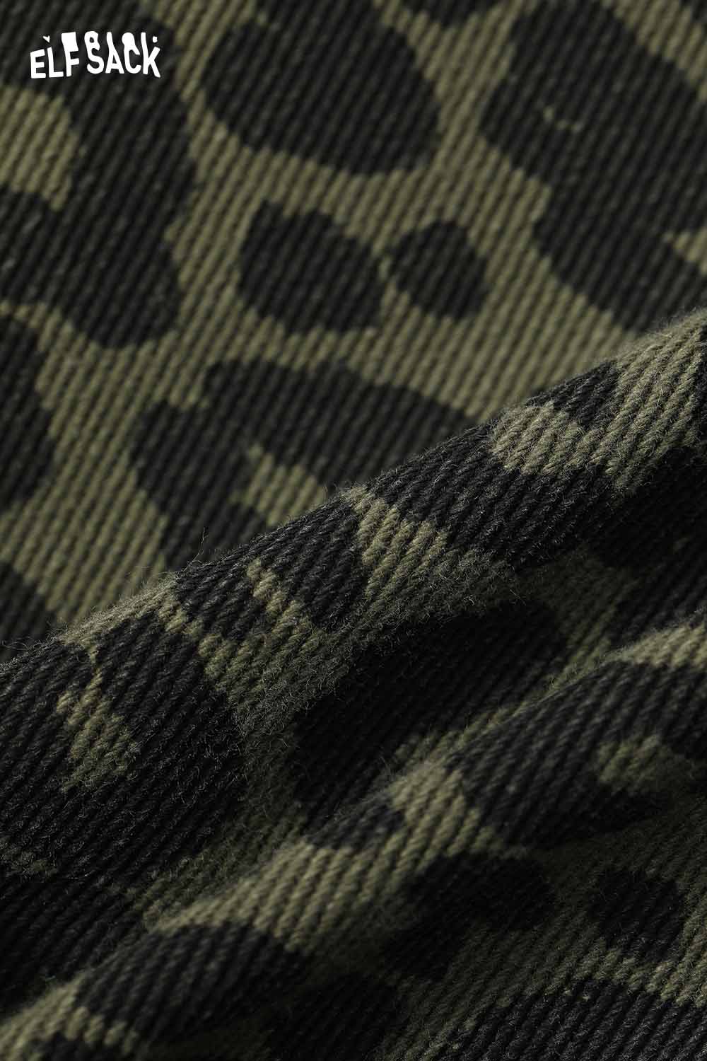 Close-up of ELFSACK animal print denim mini skirt showcasing a stylish leopard pattern in dark colors