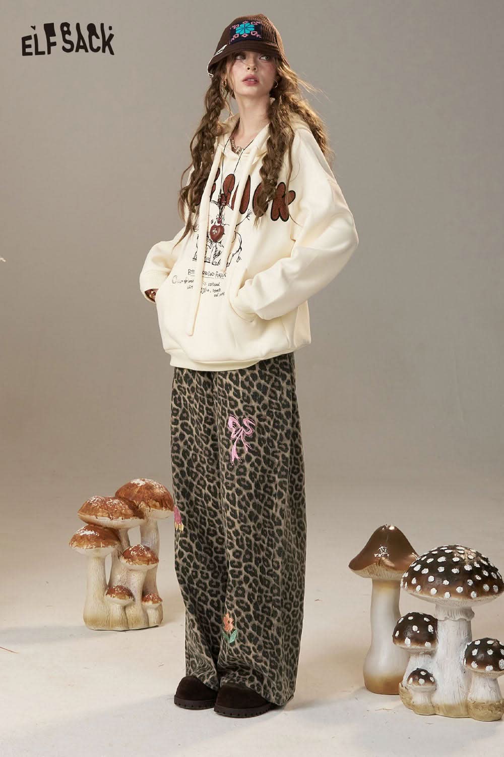 Trendy ELFSACK animal print embroidered jeans for women styled with a casual hoodie