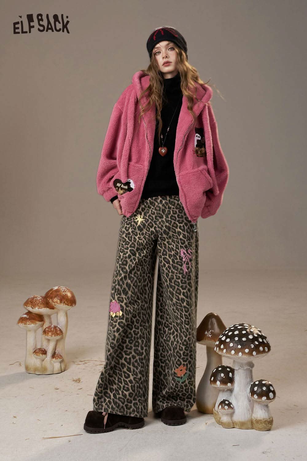 ELFSACK animal print embroidered jeans for women styled with a pink fuzzy jacket and accessories