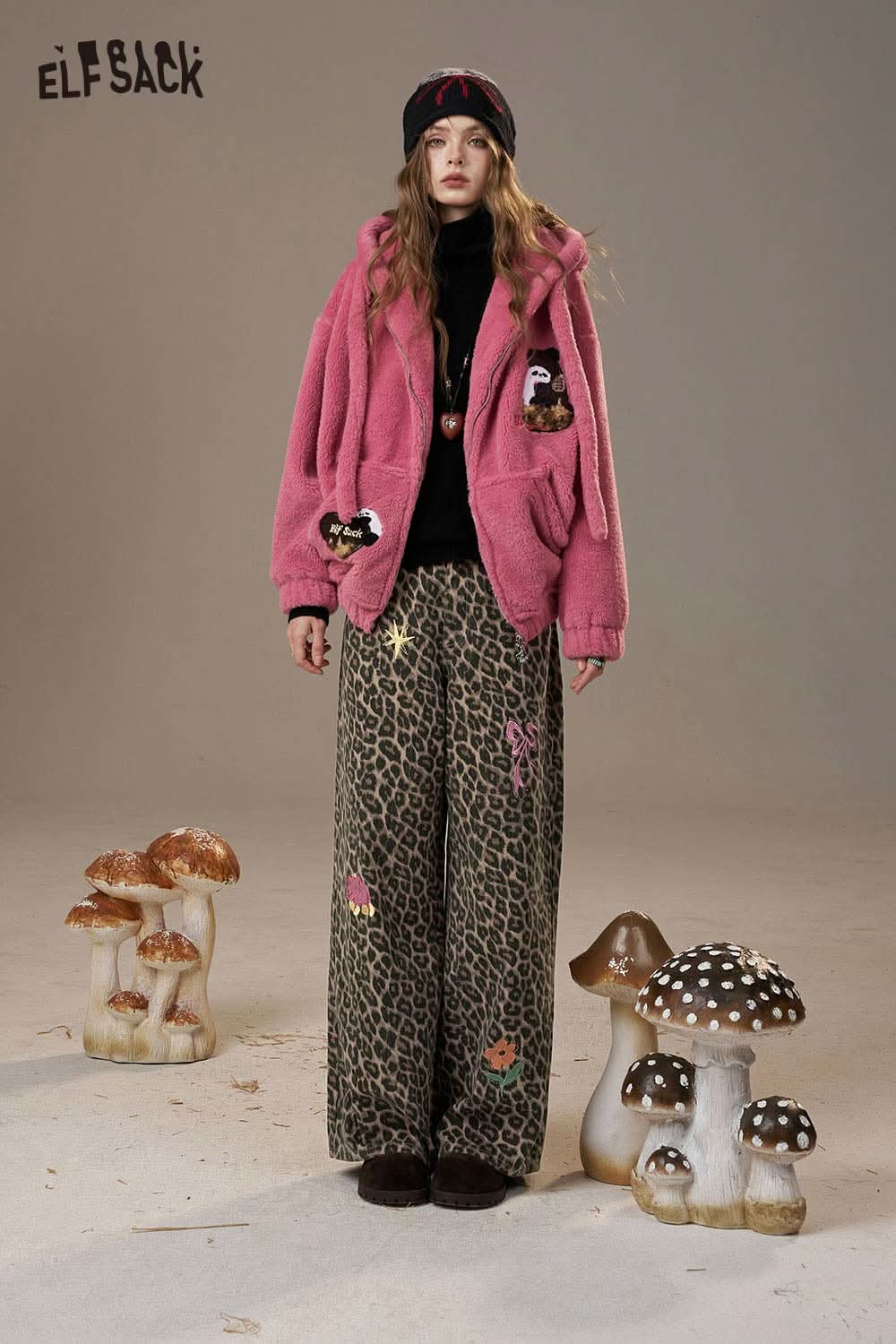 ELFSACK animal print embroidered jeans for women styled with a pink fluffy jacket and beanie
