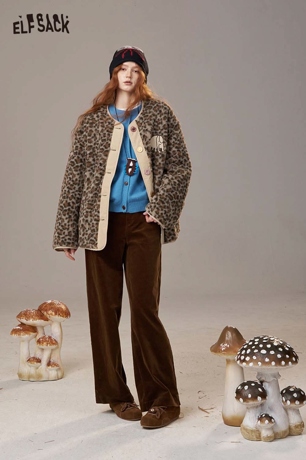 ELFSACK animal print faux shearling jacket styled with a cozy blue sweater and brown pants