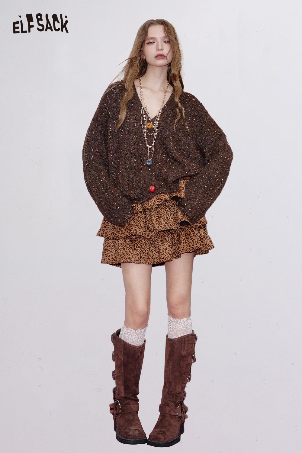 ELFSACK animal print pleated skirt styled with a cozy brown sweater and fashionable boots
