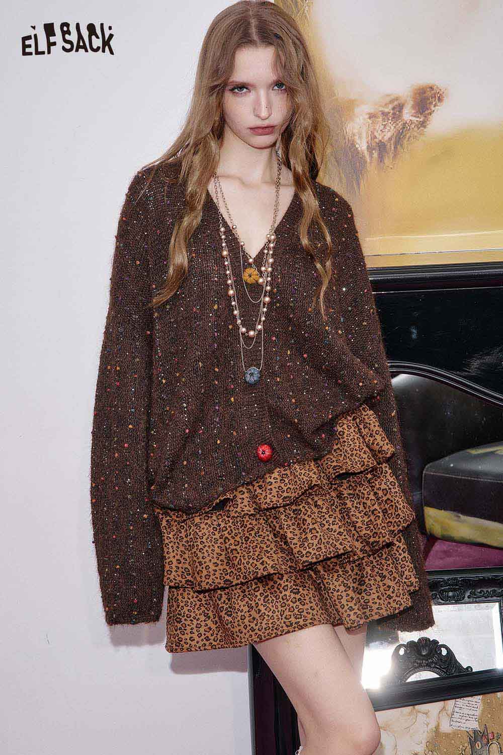 ELFSACK animal print pleated skirt styled with a cozy brown sweater for a chic look