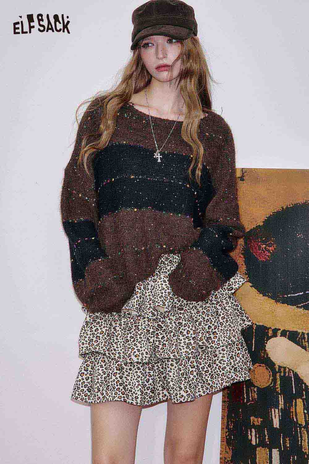 ELFSACK animal print pleated skirt featuring a stylish ruffled design with a trendy oversized sweater