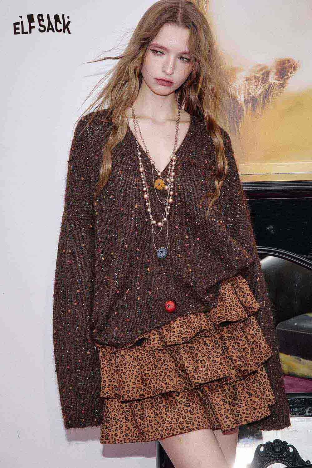 ELFSACK animal print tiered skirt paired with a cozy brown sweater for a stylish layered look