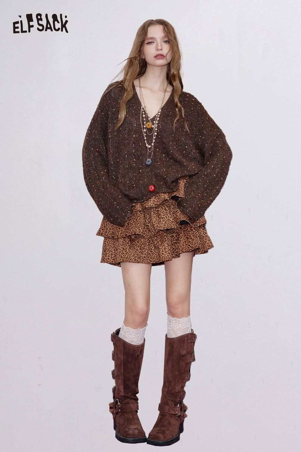ELFSACK animal print tiered skirt with ruffle details, paired with a cozy sweater and stylish boots