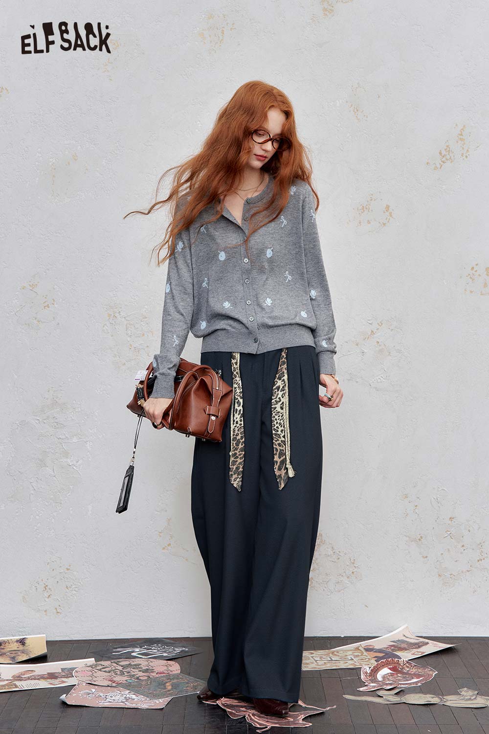 ELFSACK animal print wide leg trousers paired with a stylish gray sweater and handbag