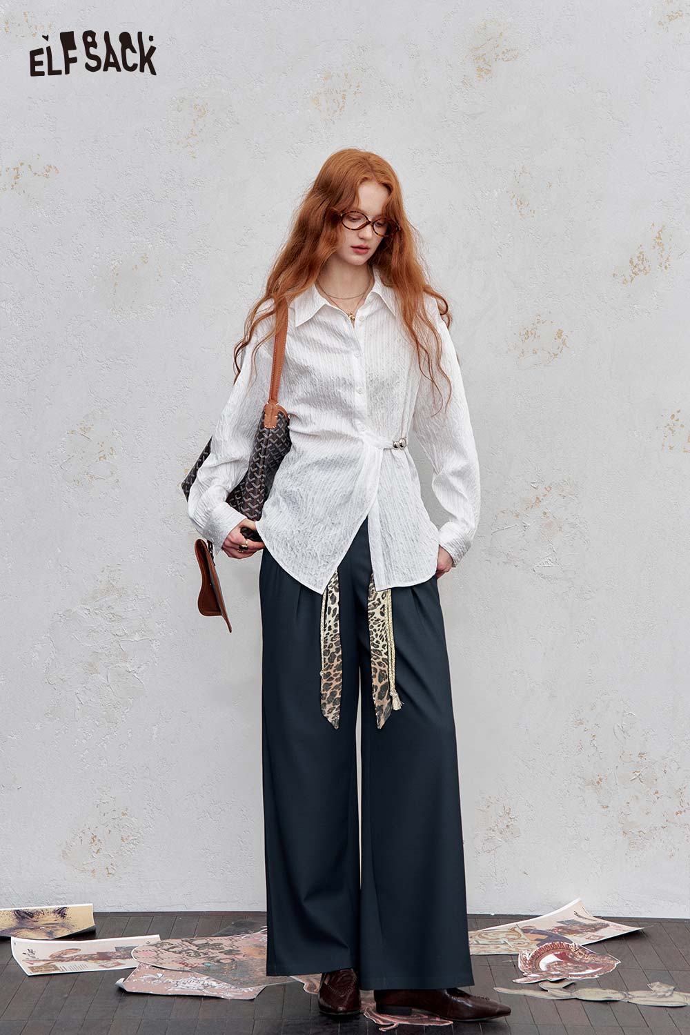 ELFSACK animal print wide leg trousers styled with a white shirt and accessories in a textured setting
