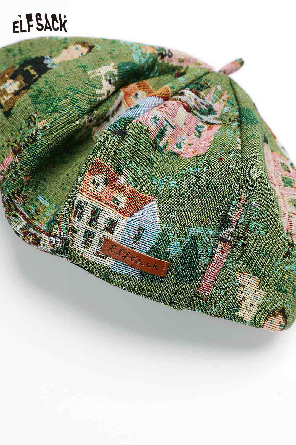 Artist inspired beret for women featuring a colorful village print and ELFSACK logo